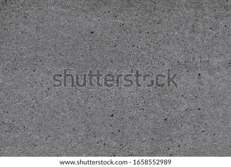 old grey clean cement wall with small cracks for vintage background