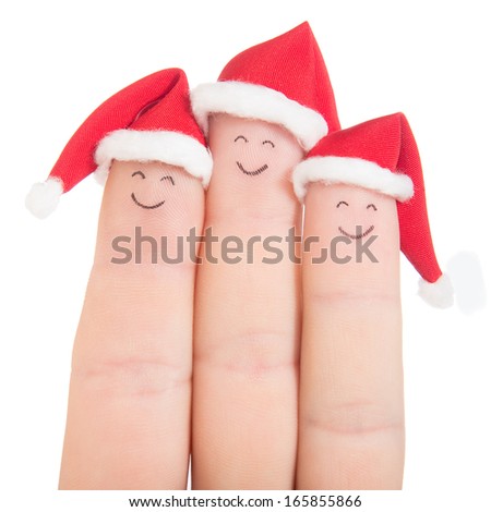 Fingers faces in Santa hats isolated on white background. Happy family celebrating concept for Christmas day.