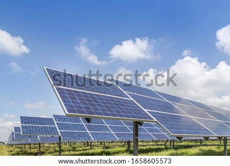 Solar panels produces green in power station against blue sky alternative renewable energy from the sun Royalty-Free Stock Photo #1658605573