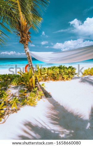 Holiday vacation tropical scene of beautiful white sand beach, turquoise ocean lagoon and foliage. Vacation in paradise. Mahe Island, Seychelles
