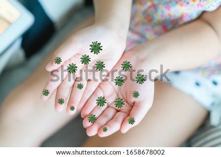 Covid-19 and bacteria , Germs in hands concept.Little asian chinese girl showing dirty hands with virus covid19.Concept for wash hands first in Kids. Covid19 coronavirus and epidemic virus symptoms.