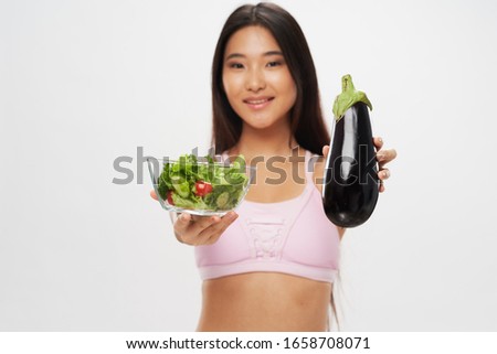 Cheerful beautiful woman slim figure vegetables diet