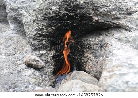 burning gass fire on the mountain Chimera. Famous Lician tourist way near Cirali in Turkey