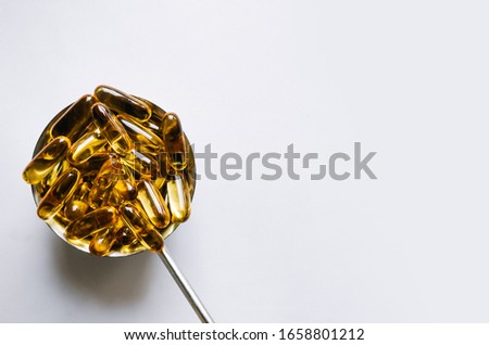 Fish oil, omega 3 capsules on a light background. Health