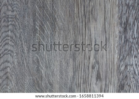 The dark grey wood background