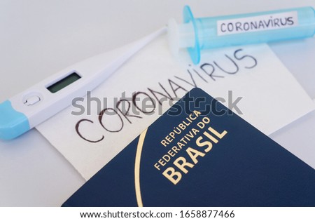 Translation: Federative Republic of Brazil. / Brazilian passport, face mask, syringe and thermometer. Coronavirus in Brazil concept. Coronavirus alert. Travel concept.