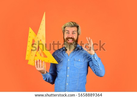 man teacher use triangle tool. bearded tutor man with ruler. draw and measure. back to school. favorite subject and disciplines. Education at school. home learning concept.