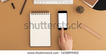 Close up of men's hands scrolling mobile, telephone blank copy space screen for your text, message or promotional content.