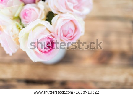 beautiful roses on a table view from above.