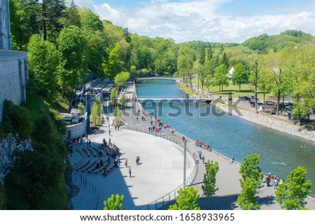 Lourdes, France: 2017 1 may: Morning in the  River in The Sanctuary of Our Lady of Lourdes is one of the largest pilgrimage centers in Europe Royalty-Free Stock Photo #1658933965