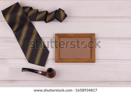 Set of male accessories on a wooden background, copy space for text, top view. Father's Day Greeting Card Concept