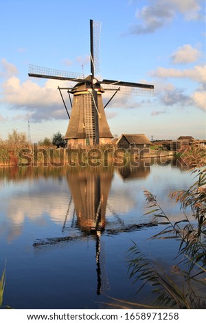 Molenlanden, Netherlands - Rural landscape with traditional windmills at an old Dutch village Kinderdijk in Holland. UNESCO World Heritage.