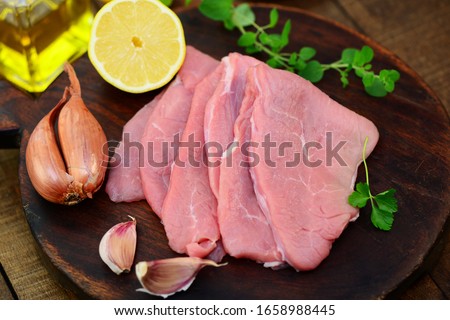 
Veal escalope with shallots lemon and herbs Royalty-Free Stock Photo #1658988445