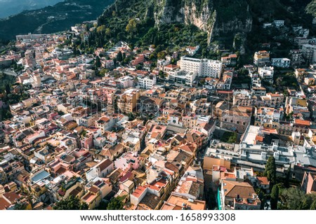 City of Taormina seen from above, drone view, aerial shot of a beautiful Sicilian Town