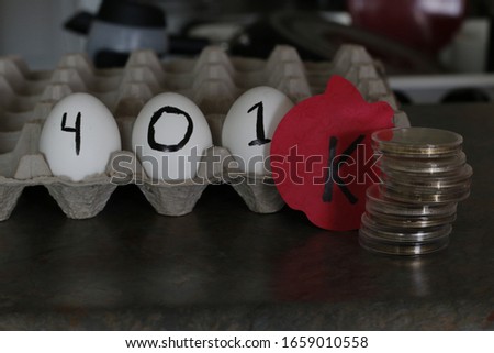 The word 401k wrote on eggs. Theme of nest egg for retirement