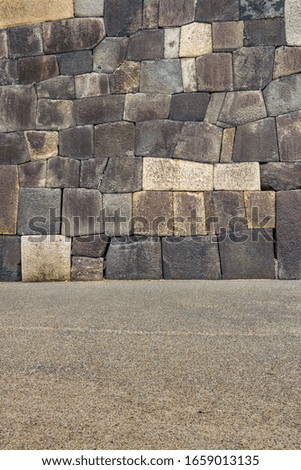 Ancient stone patterned wall of imperial palace gardens, tokyo, japan