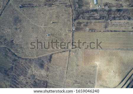 Aerial view over agricultural fields in the autumn time