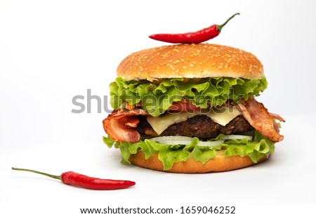 
Hamburger with bacon and chili pepper on a white background