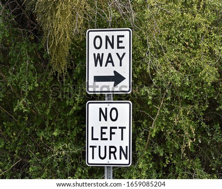 One Way No Left Turn Sign With Direction Arrow