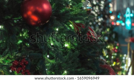 BLURRED Christmas tree decorations with illuminations. New Year card.Xmas tree.Christmas balls, toys. New year and festive mood. Template.  Modern design style for the holiday.Blurred background. 