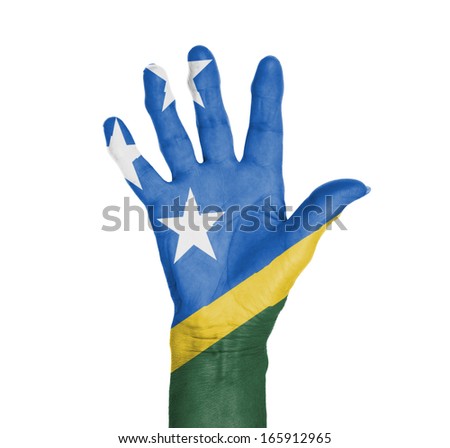 Palm of a woman hand, painted with flag of The Solomon Islands