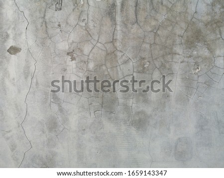 defocused of gray cement wall.concrete pattern have cracked.copy space concept.