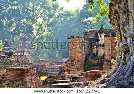 photo Buddha image in stone temple