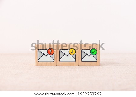 The concept of a mail message on wooden cubes and a light background