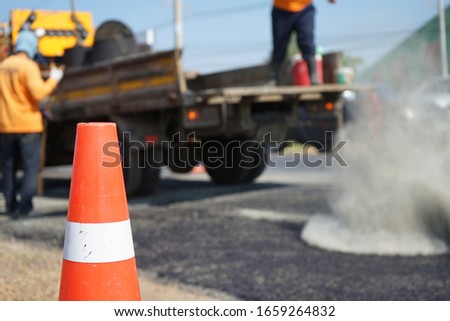 Red rubber cone in road construction And background blur