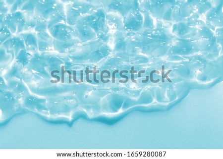 summer blue cosmetic gel cream abstract or pure natural water wave texture background