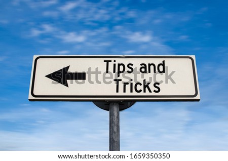 Tips and tricks road sign, arrow on blue sky background. One way blank road sign with copy space. Arrow on a pole pointing in one direction.