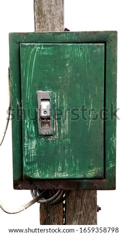 Green Electric shield box on a Wooden pole. Green iron box.