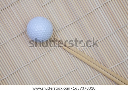 Top View With Bamboo Chopsticks and Mat and Golf Ball. Golf  Design