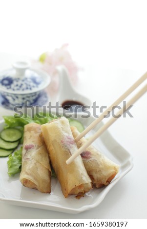 Chinese food, homemade dumpling Sakura edible flower and spring roll for fusion spring roll image