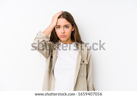 Young caucasian woman  isolated tired and very sleepy keeping hand on head.