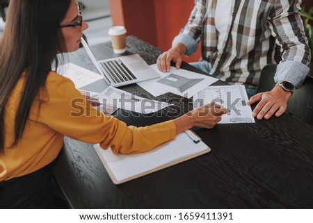 Young woman and man discussing room layout stock photo