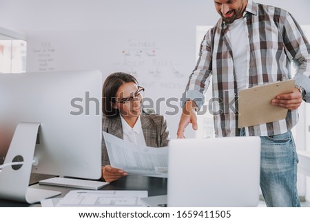 Pretty businesswoman reviewing a project in the office stock photo