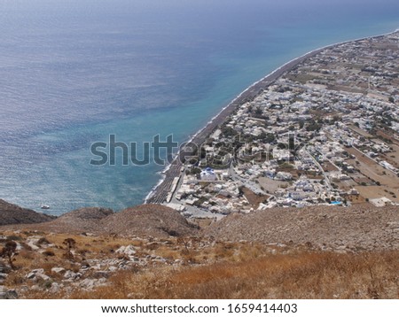 Panoramic view of the village of Perissa on Santorini island, from the top of the mountain. Aerial view of the Mediterranean Sea and beaches.