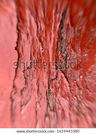 Macro closeup view of a red painted wooden bench