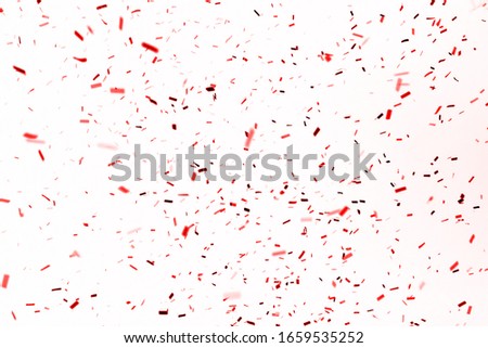 Thousands of confetti fired on air during a festival. Image ideal for backgrounds. Red are the confetti in the picture.
White background. 