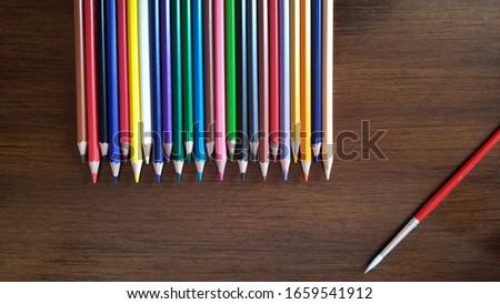 colorful pencil on the wooden background