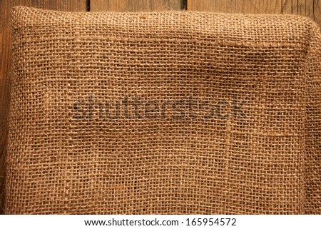 Wood and jute texture/Cookbook background. Wood Table with jute coarse grain canvas texture.