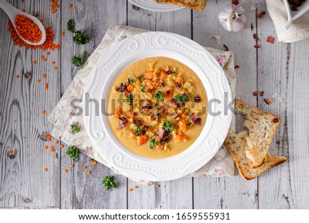Bio organic soup with fried bacon and toast