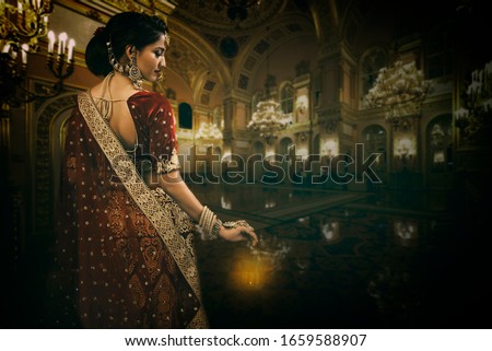 Young Indian Bride in bridal wear and jewelry Royalty-Free Stock Photo #1659588907