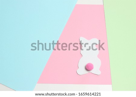 Easter modern pastel paper background with bunny.