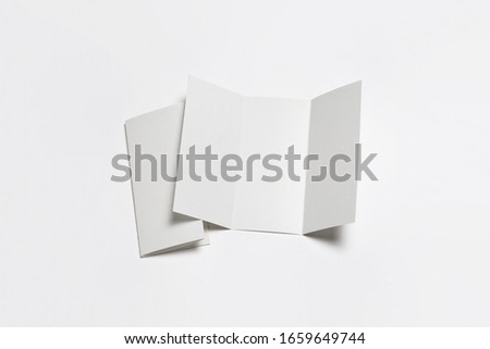 A4. Blank Trifold Paper Brochure Mock-up on soft gray background with shadow.High resolution photo.Top view
