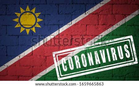 Flag of the Namibia on brick wall texture. stamped of Coronavirus. Corona virus concept. On the verge of a COVID-19 or 2019-nCoV Pandemic. Novel Chinese Coronavirus outbreak