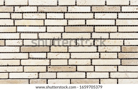 Ceramic tile mosaic laid out in the form of brickwork. Rectangular tile mosaic.