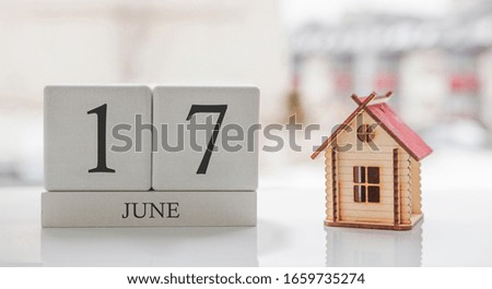 June calendar and toy home. Day 17 of month. Card message for print or remember
