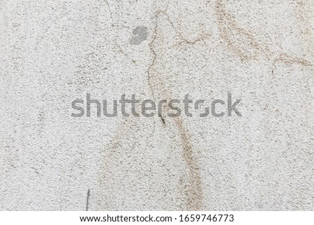 Wall with cracks and dried paint.